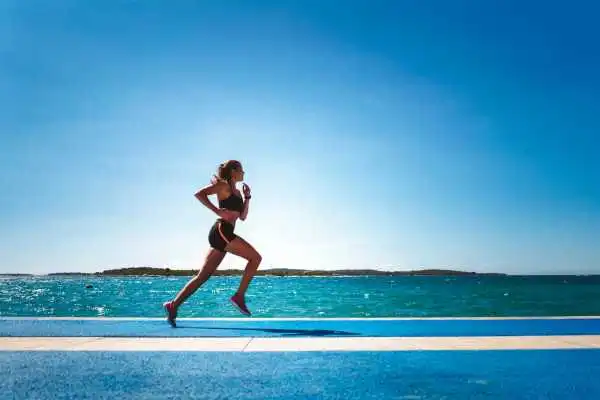 Woman running showing strong leg muscle Buckingham